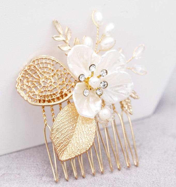 Bridal hair comb with gold leaf and white pearl flower, rhinestone details, long pins