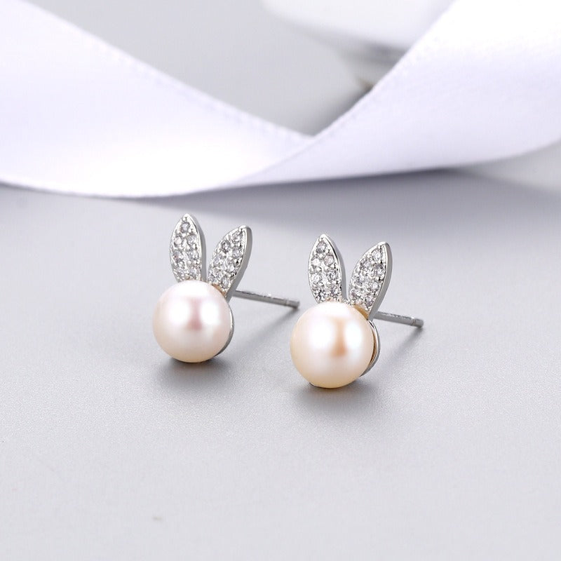 Silver-tone rabbit zircon stud earrings with round white pearl and crystal details