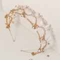 Gold rhinestone leaf bride headband with curved frame and two hairpin posts