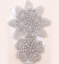 White ribbon headband with silver crystal flower and leaf centerpiece