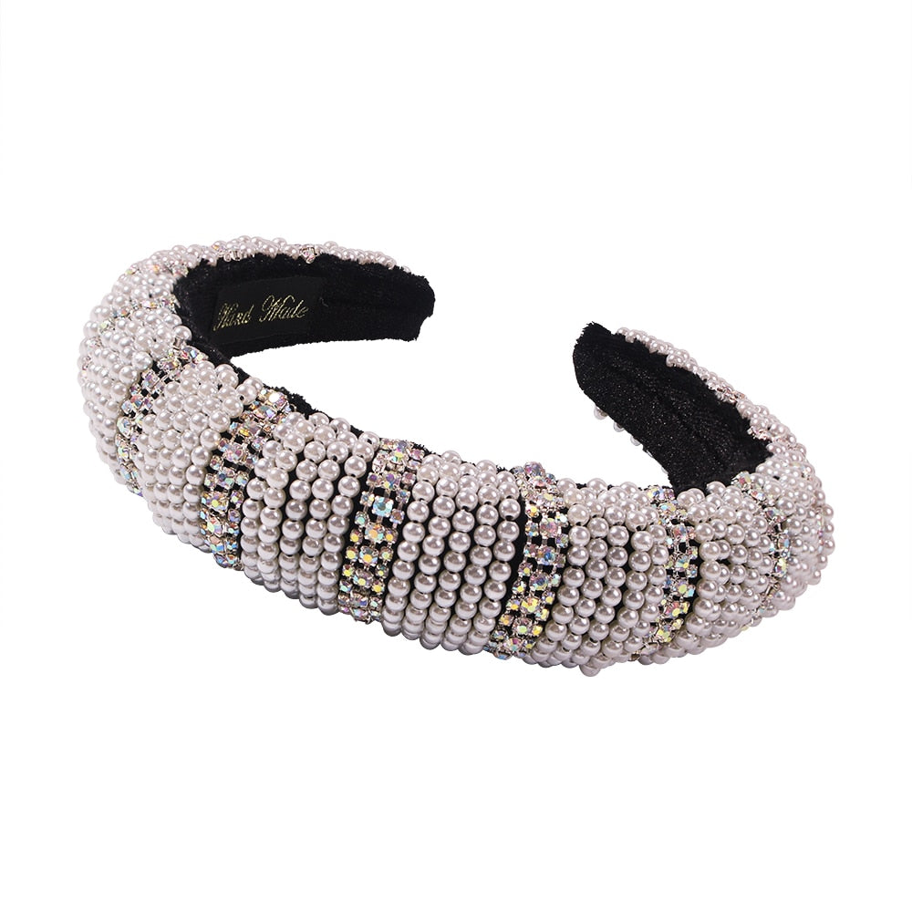 White faux pearl wide headband with black inner padding and beaded rhinestone trim