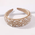 White faux pearl fringe headband with wide beige inner band and gold-tone edging