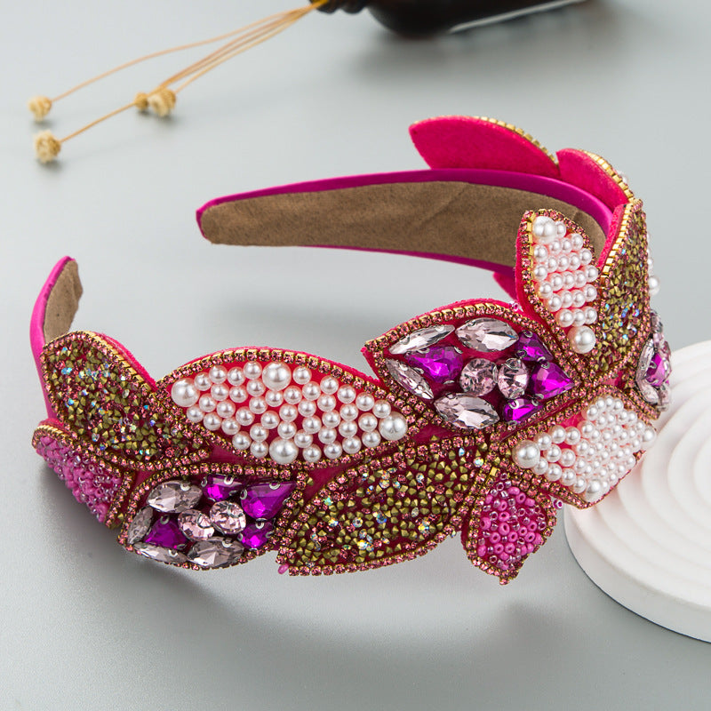 Wide pearl and rhinestone headband with purple gems and pink velvet leaves
