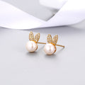 Gold-tone rabbit zircon stud earrings with round white pearl and crystal accents
