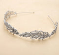 Crystal bridal crown headband with ornate leaf filigree and dangling stones