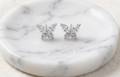 Silver butterfly stud earrings with clear rhinestone wings on round stud posts