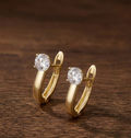 Light gold hoop earrings with white round solitaire stone