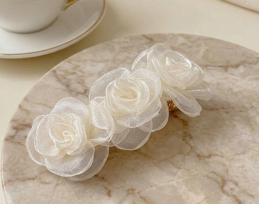 Champagne satin rose clip-on barrette with three sheer-textured rosettes.