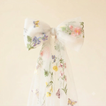 White tulle hair bow with embroidered flowers and butterflies and long sheer ribbon tails
