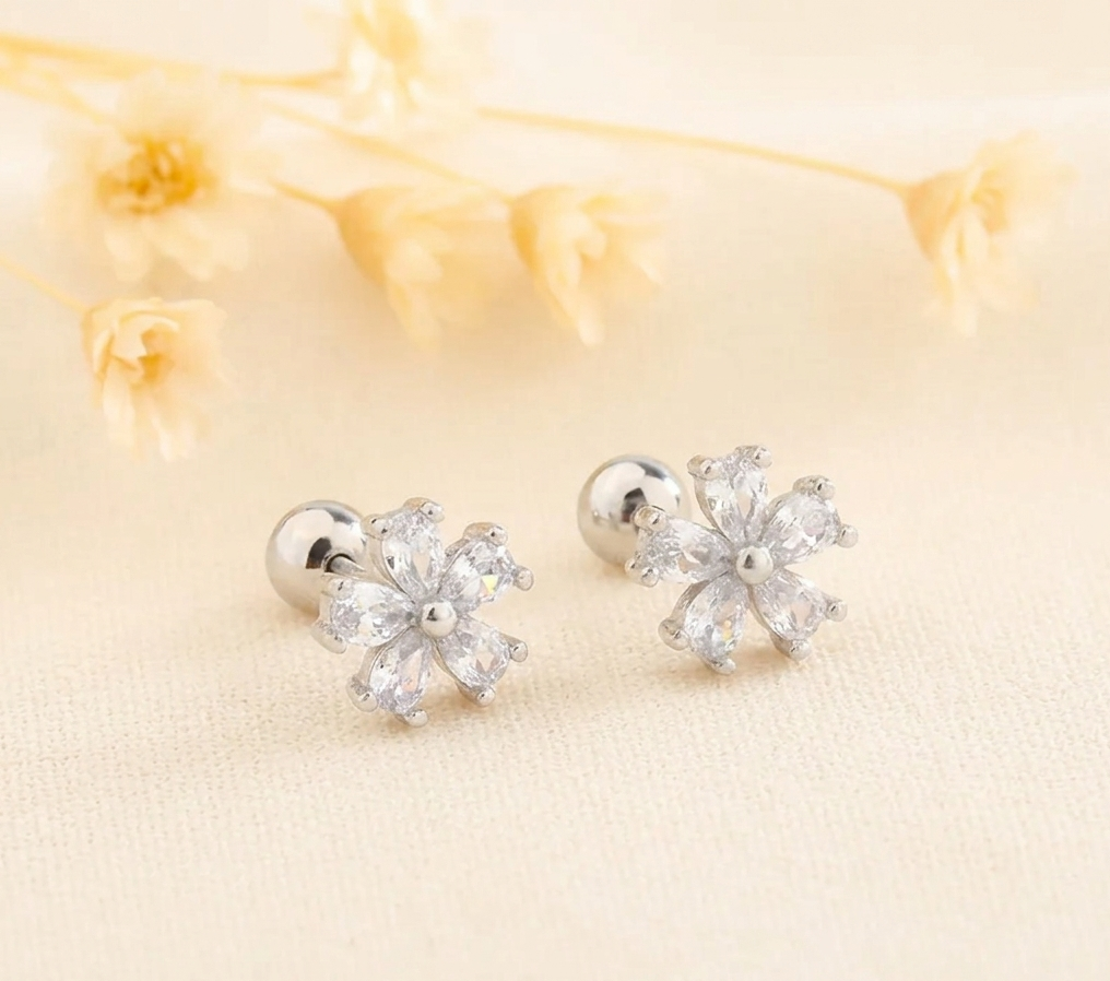 Cluster flower huggie hoop earrings with clear crystal petals and silver-tone