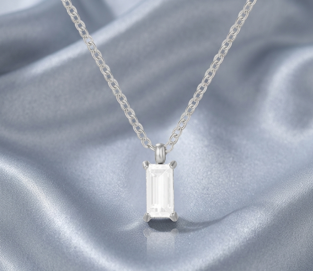 Silver-tone statement necklace with baguette drop crystal pendant and prong setting