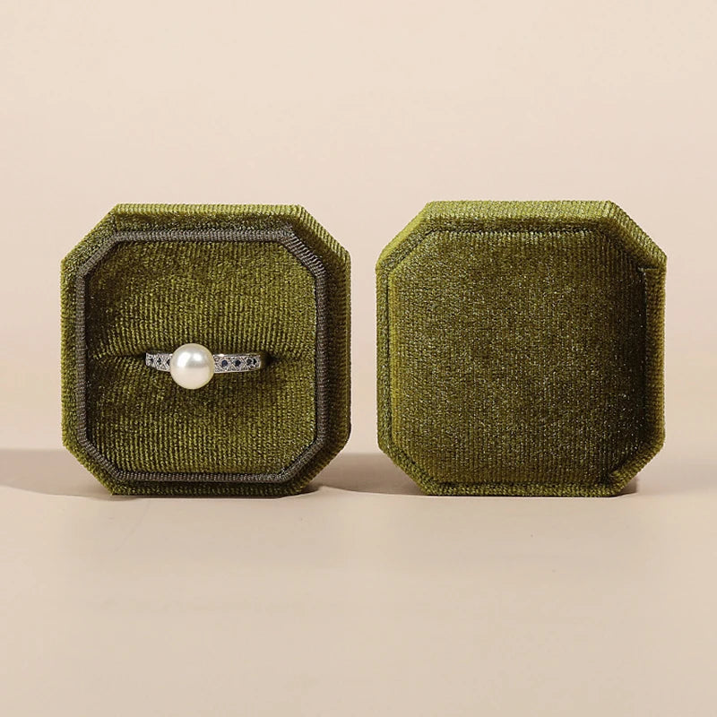 Olive octagonal velvet ring box front and side views with a pearl ring