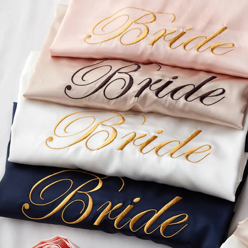 Satin bridal robe stack, blush and navy satin with gold “Bride” script