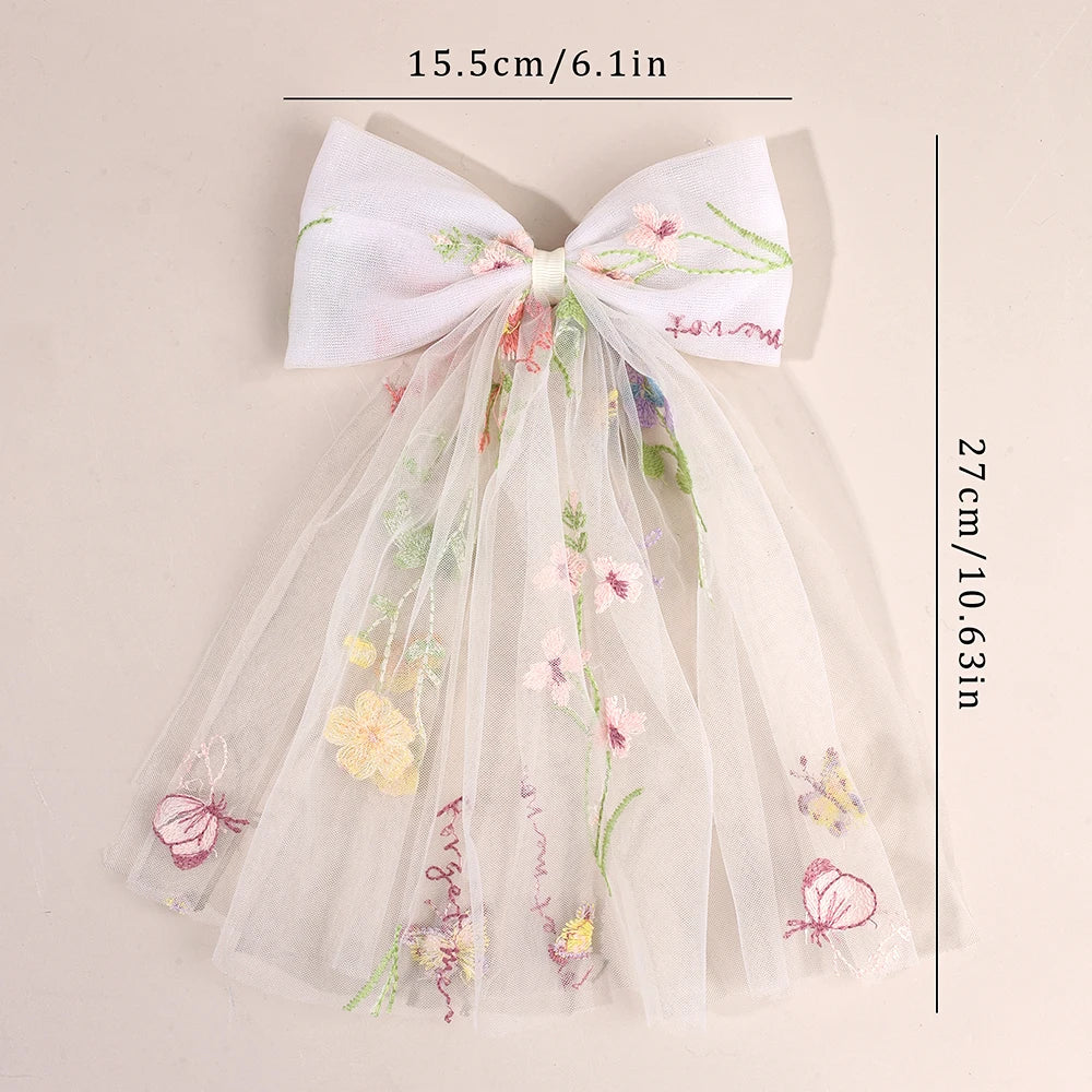 Pastel floral-embroidered tulle bow hair clip with long sheer veil strands