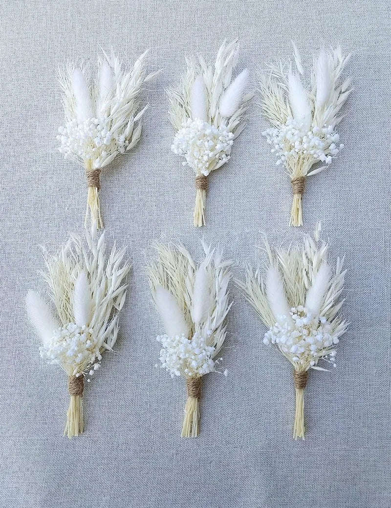Set of white dried flower boutonnieres with feather pampas plumes and tiny pearl blooms
