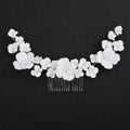 Bridal cascading orchid hair comb with white floral blossoms and silver-tone comb base