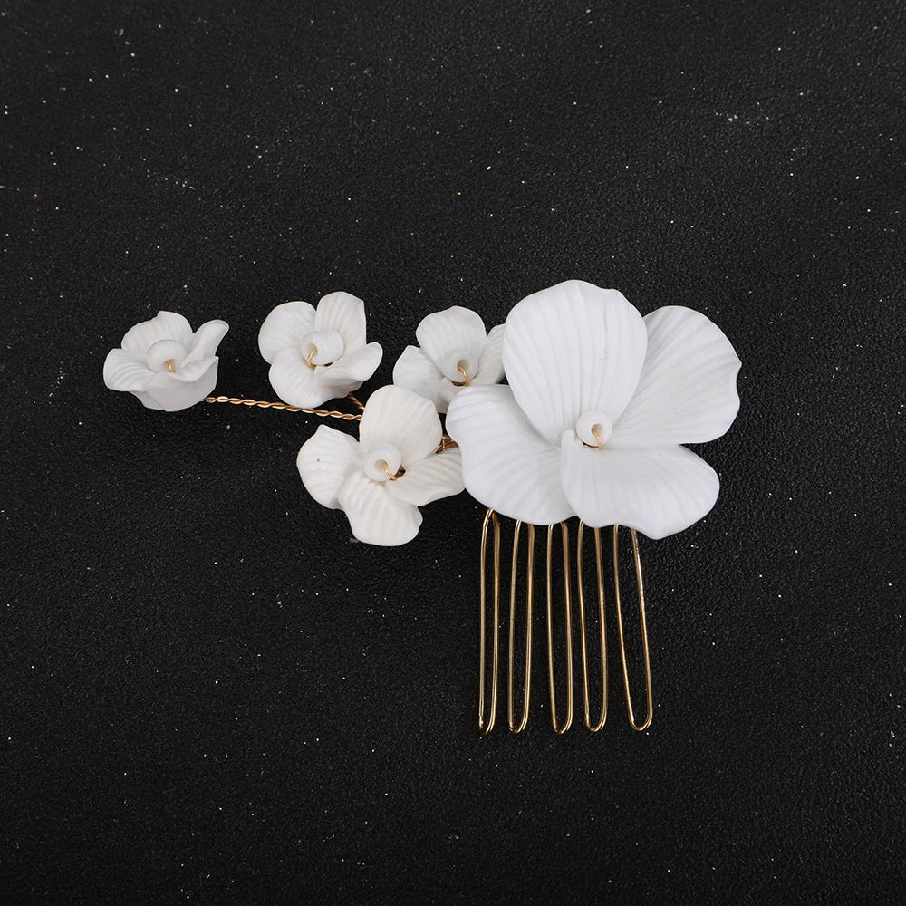 Bridal hair comb with white orchid blossom flowers and gold-tone metal pins