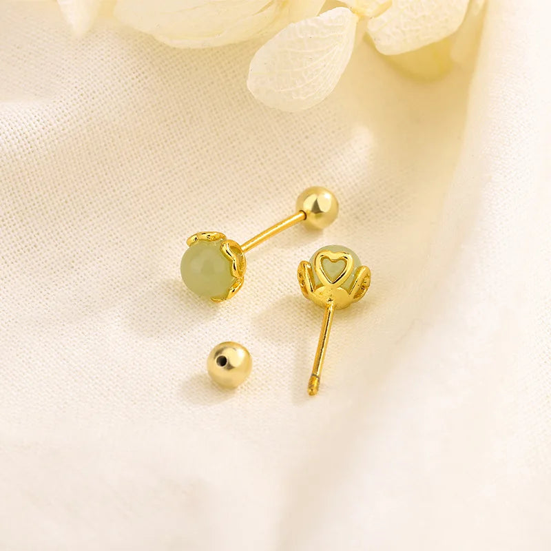 Gold heart stud earrings with dangling heart charm, ball posts