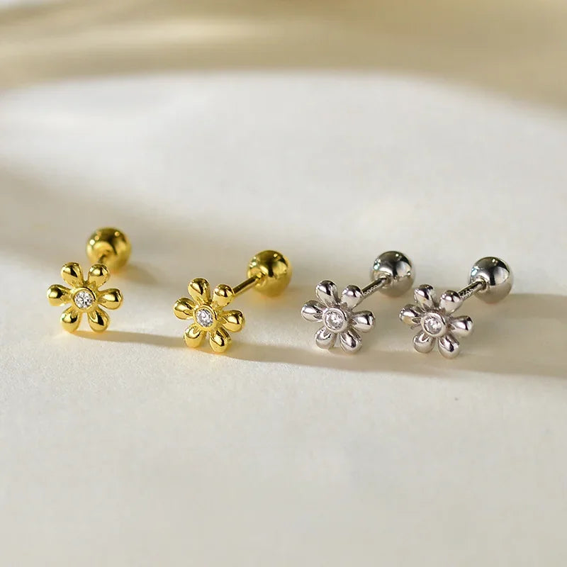 Daisy flower zircon stud earrings in gold and silver tones, round crystal centers