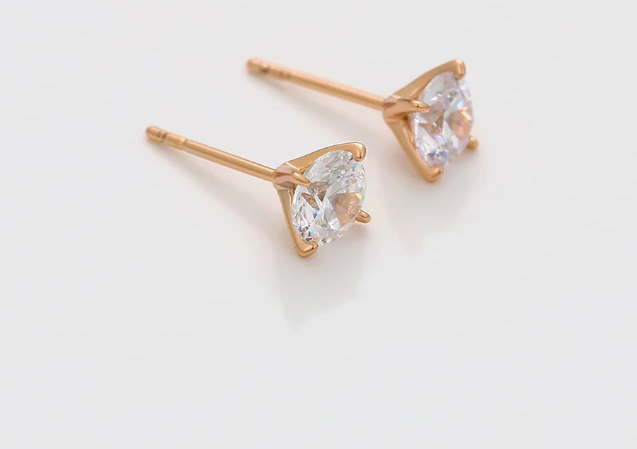 Gold-tone diamond stud earrings with round white stones in four-prong setting