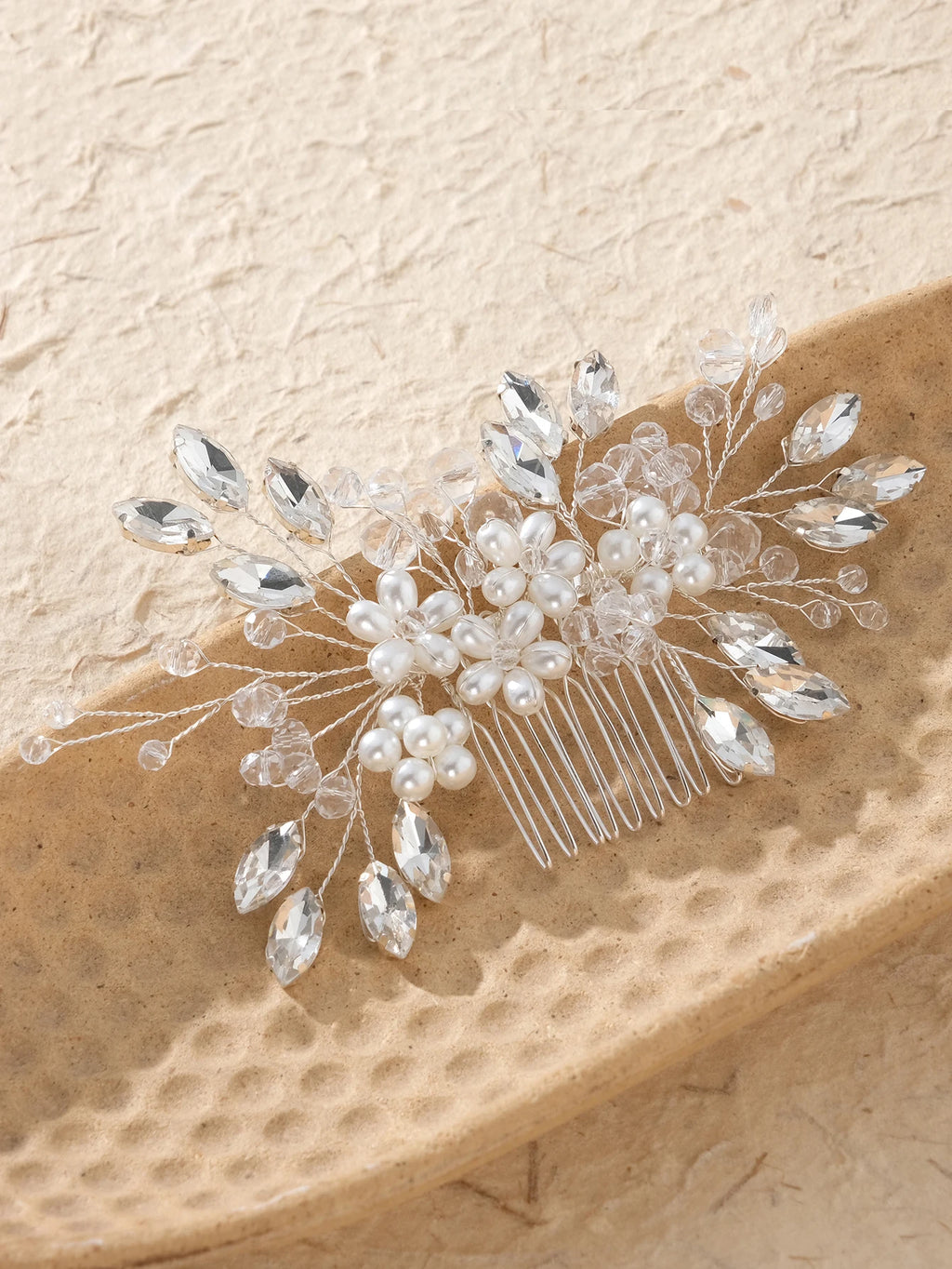 Bridal hair comb with pearl center, crystal leaf drops, and multi-prong comb back