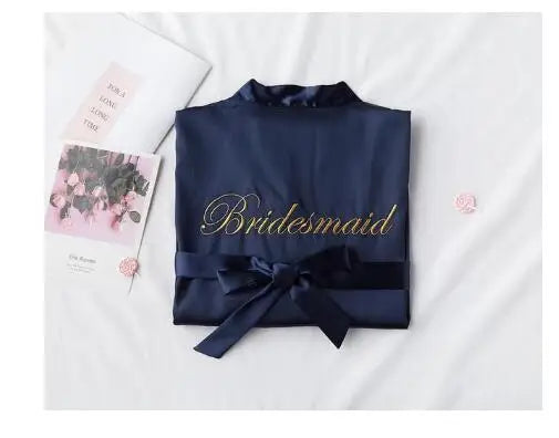 Navy satin robe with embroidered “Bridesmaid” and front waist ribbon bow