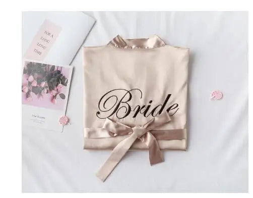 Champagne satin robe with embroidered “Bride” and front waist ribbon bow