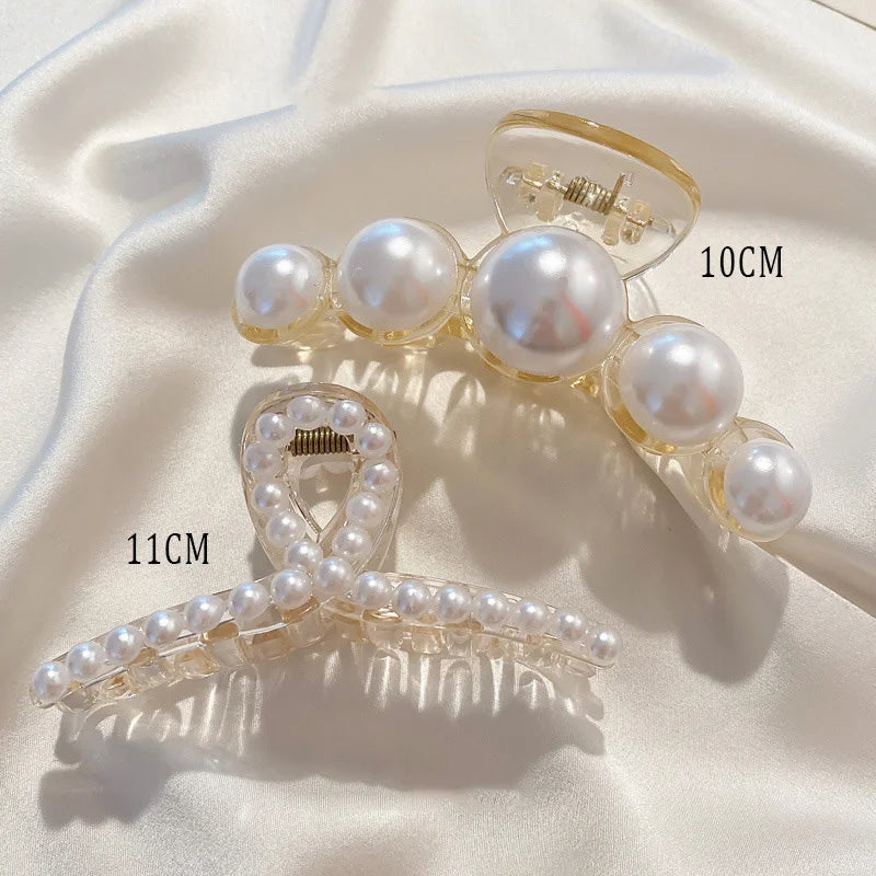 Pearl claw hair clips with gold-tone frame and white faux pearls; ~10cm and ~11cm.