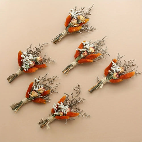 Set of 6 dried flower boutonnieres with orange flowers, white sprigs, and twine stems
