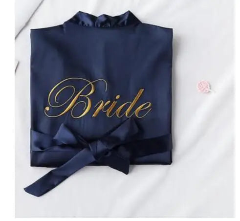 Navy satin robe with embroidered “Bride” and a matching waist tie bow