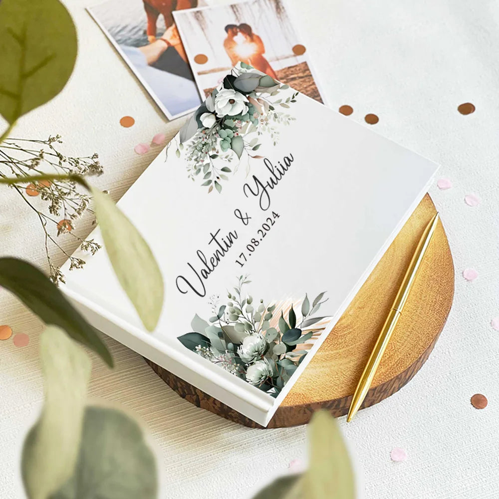 Wedding guest book with eucalyptus wreath, couple names in script, and date 17.08.2024