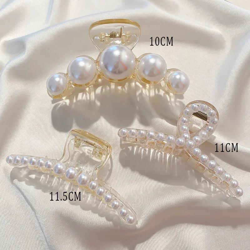 Pearl claw hair clips with gold-tone frames and white faux pearls; ~10cm, ~11cm, ~11.5cm.