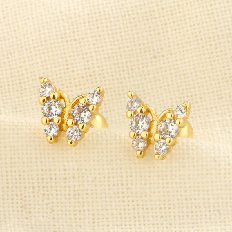 Gold clover flower stud earrings with multiple clear sparkle stones