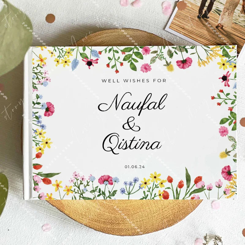Wedding guest book cover with colorful wildflower border and script names; 01.06.24
