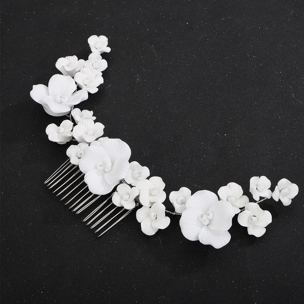 Bridal hair comb with cascading white orchids and silver-tone pin teeth