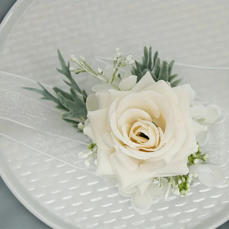 Silk rose boutonniere with ivory rose, greenery, and small white flowers
