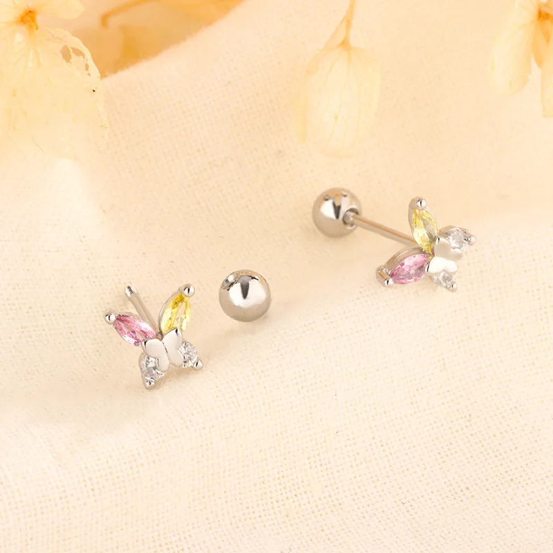 Silver huggie hoop earrings with butterfly crystal charm and round ball posts