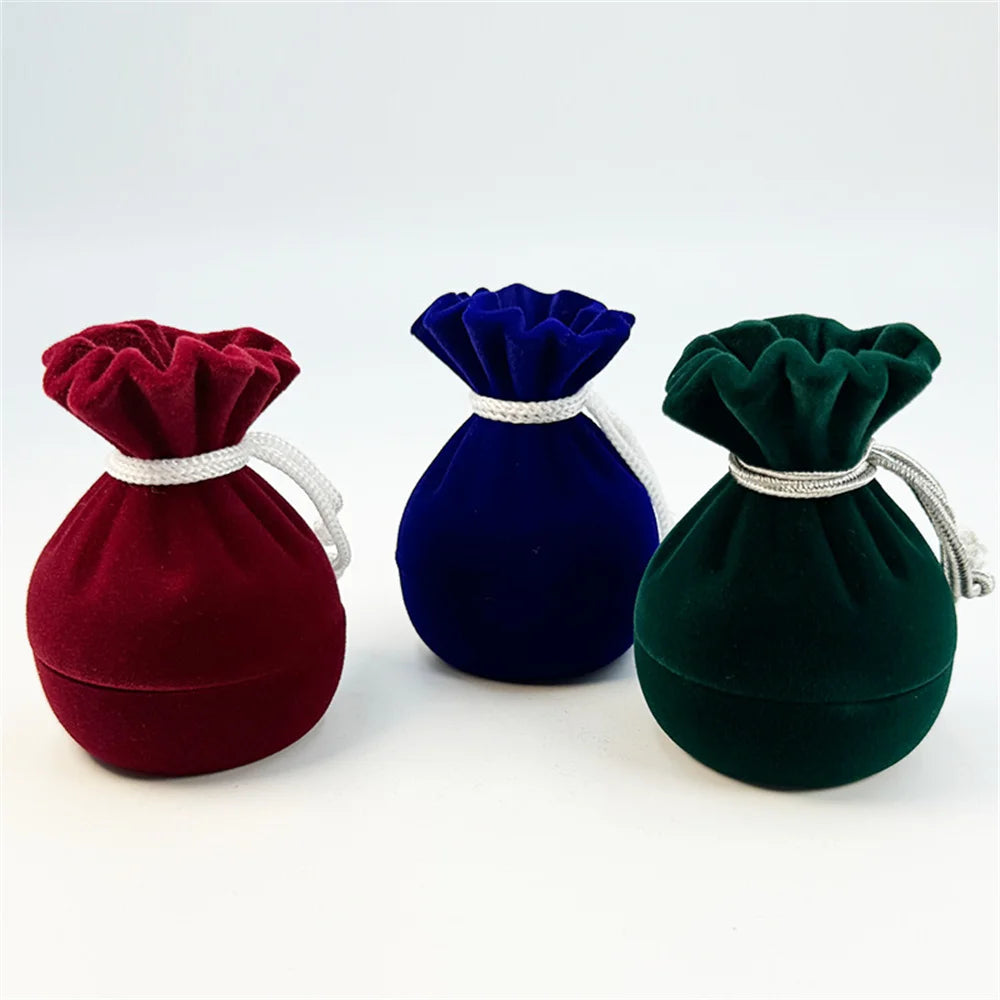 Velvet ring pouch set in red, blue, and green; each velvet drawstring pouch.