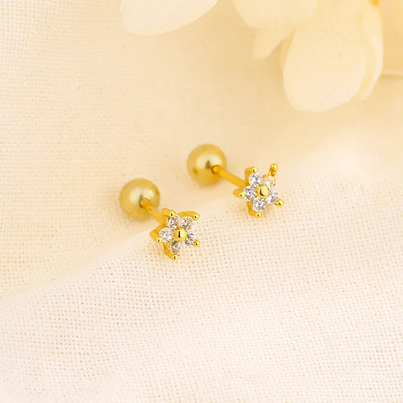 Gold-tone sparkle stud earrings with small crystal flower centers