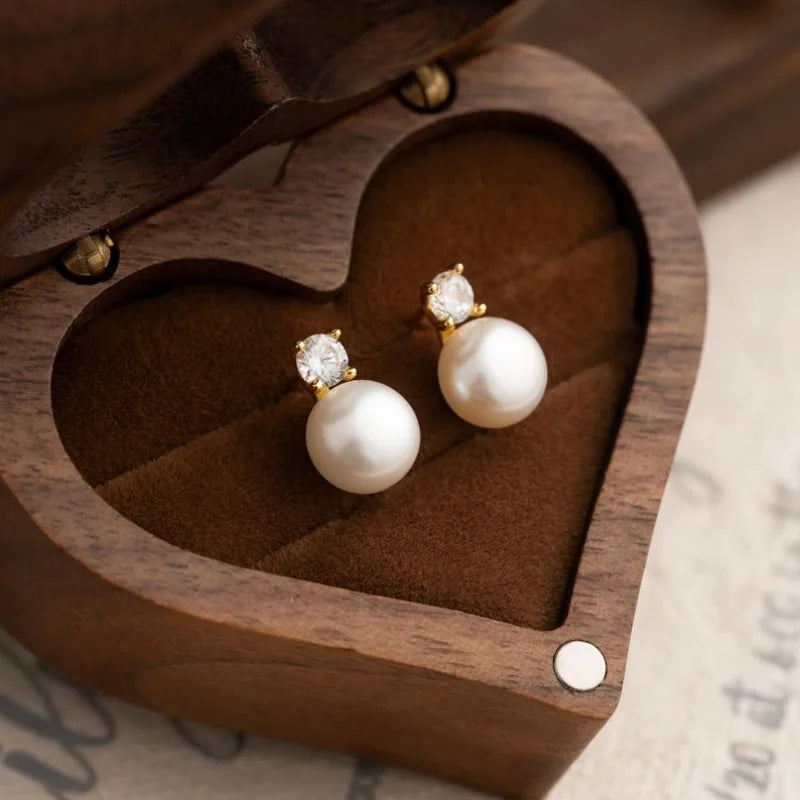 Freshwater pearl stud earrings in wooden heart box, gold-tone with crystal-like tops