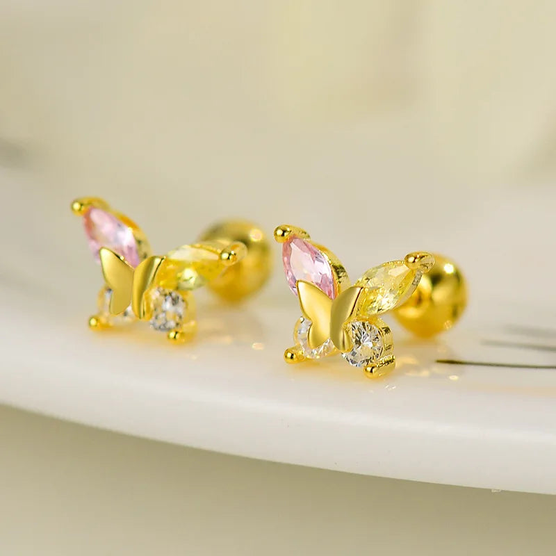 Gold stud earrings with pink teardrop stones and clear sparkle details