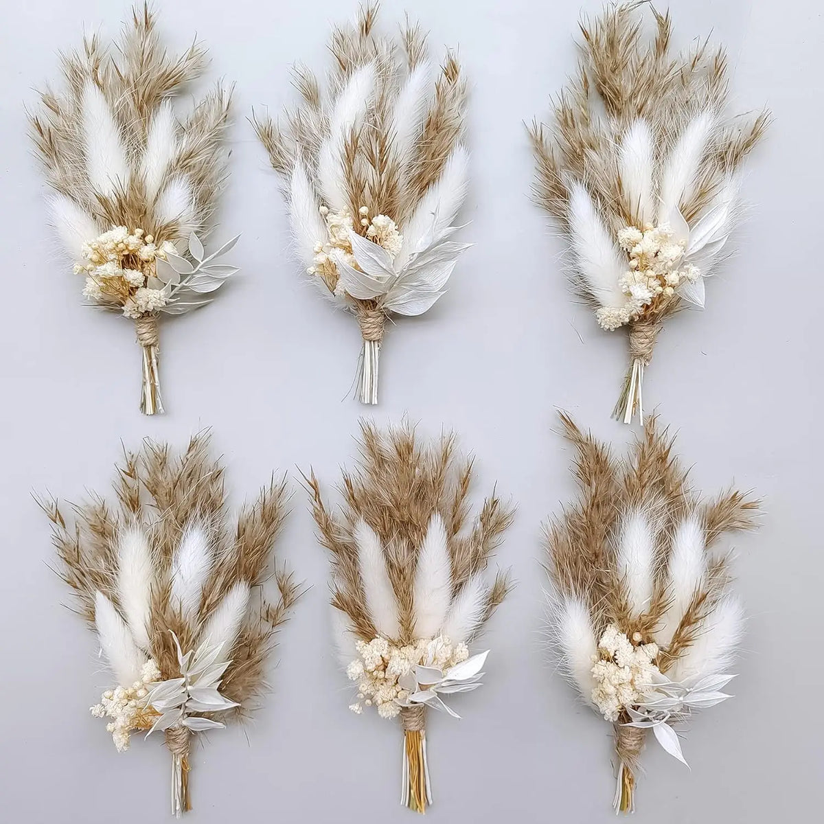 Set of dried flower boutonnieres with pampas, wheat stalks, white blossoms and gold stems
