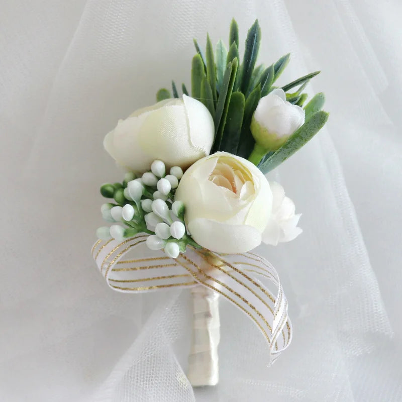 Ivory peony boutonniere with white berries, green leaves, and striped ribbon wrap