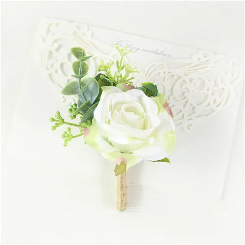 Silk botanical groom's lapel pin with white rose, light-green sprigs, and burlap stem