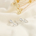 Silver tulip flower stud earrings with butterfly clasps, small petal design.