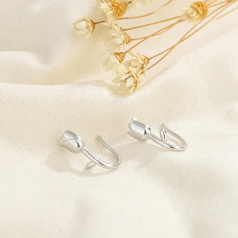 Silver tulip flower stud earrings with butterfly clasps, small petal design.