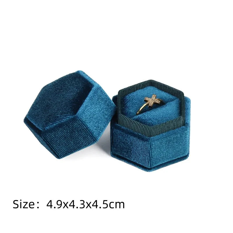 Blue octagonal velvet ring box set with star ring inside and size text