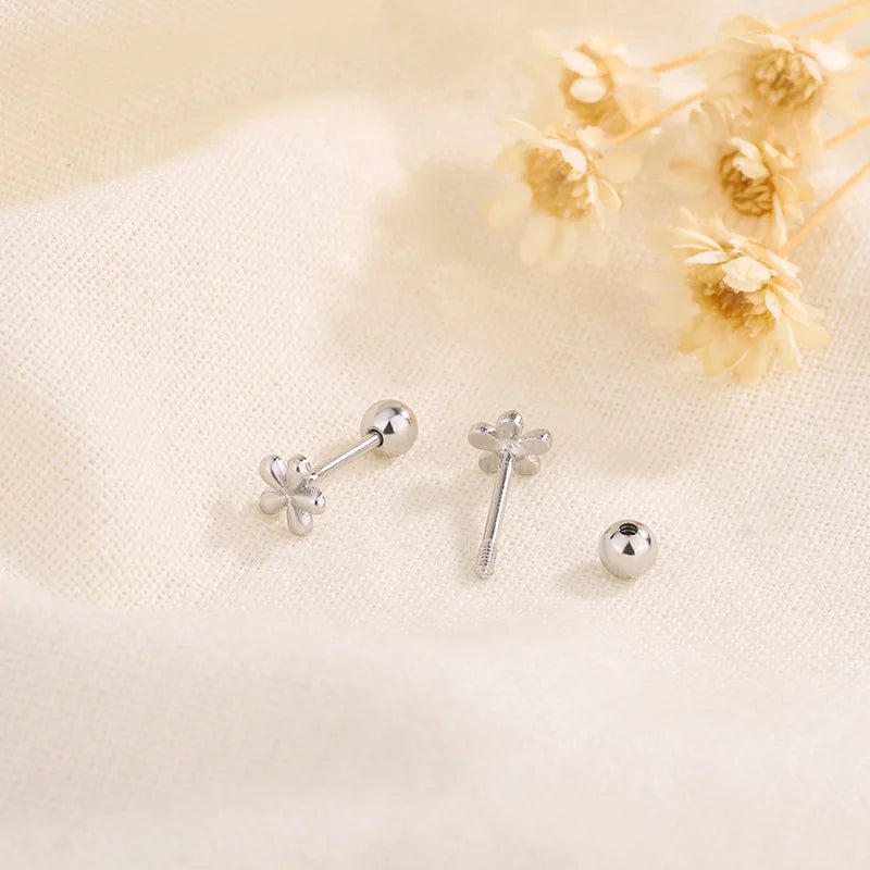 Silver stud earrings with bow-shaped crystal charms and round ball posts