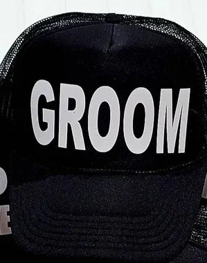 Black mesh trucker cap with bold white text: GROOM