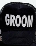 Black mesh trucker cap with bold white text: GROOM